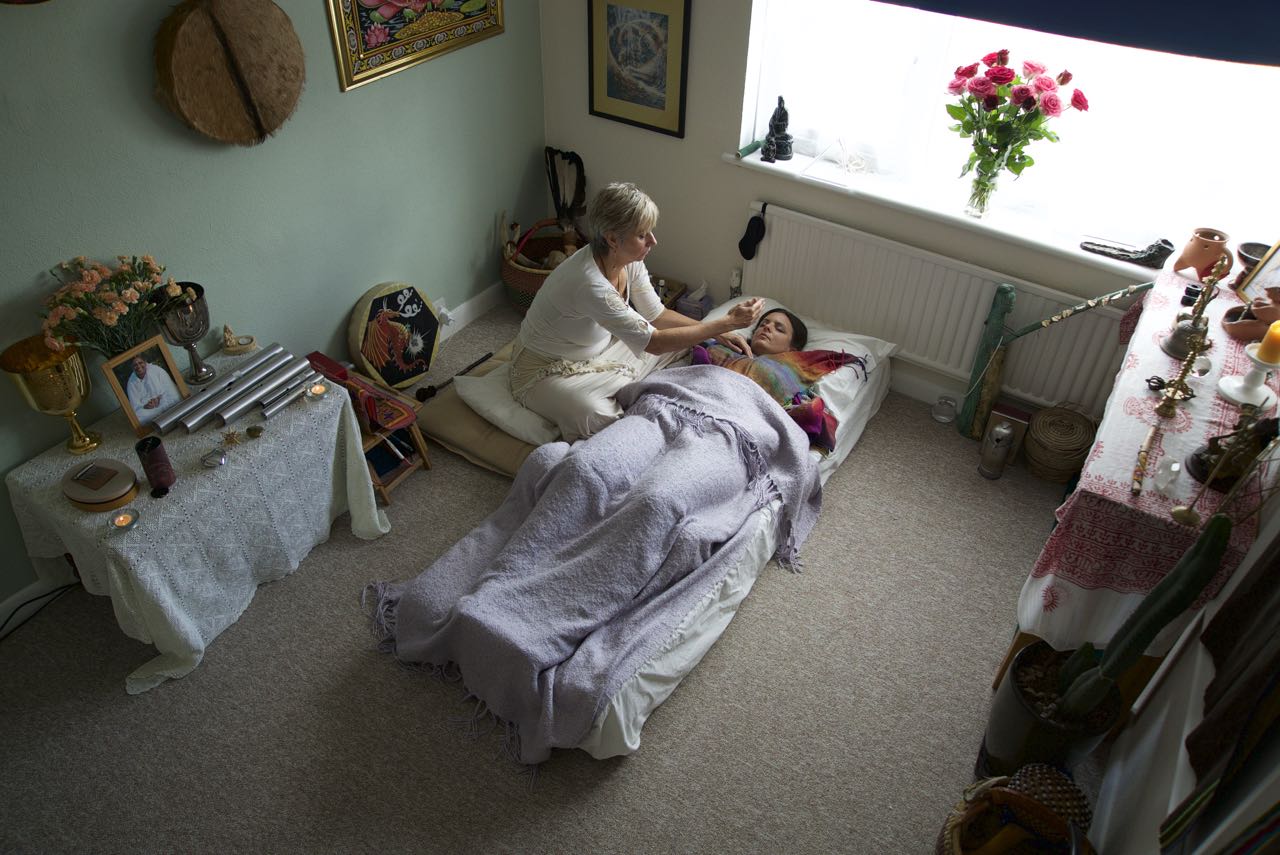 Shaman Sue Holmes completing a session, smiling into the distance