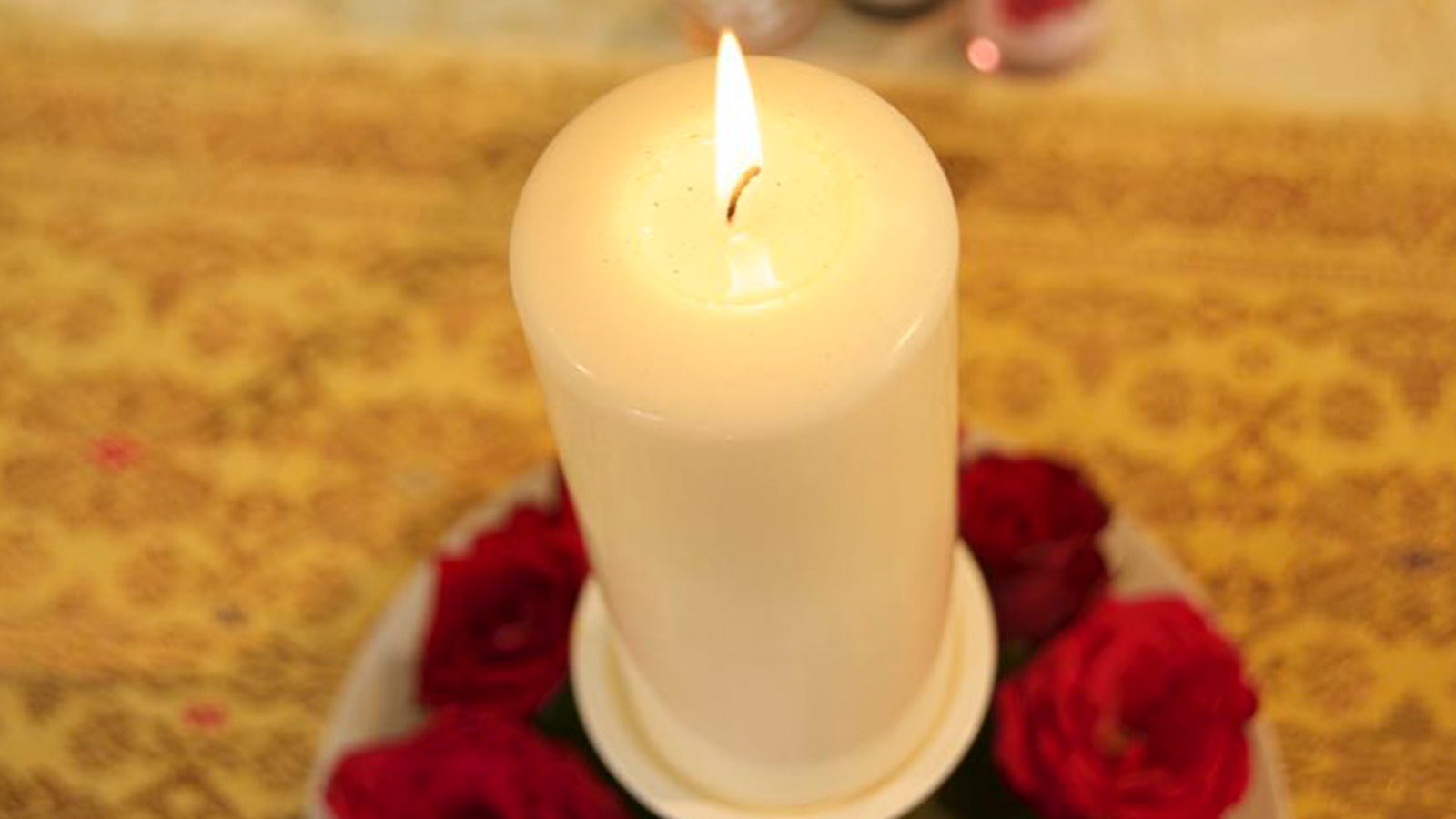 shamanic training, candle burning surrounded by roses